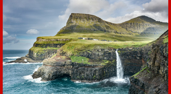 rocky coast with waterfall